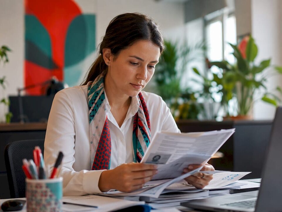 Compliance officer reviewing identity documents